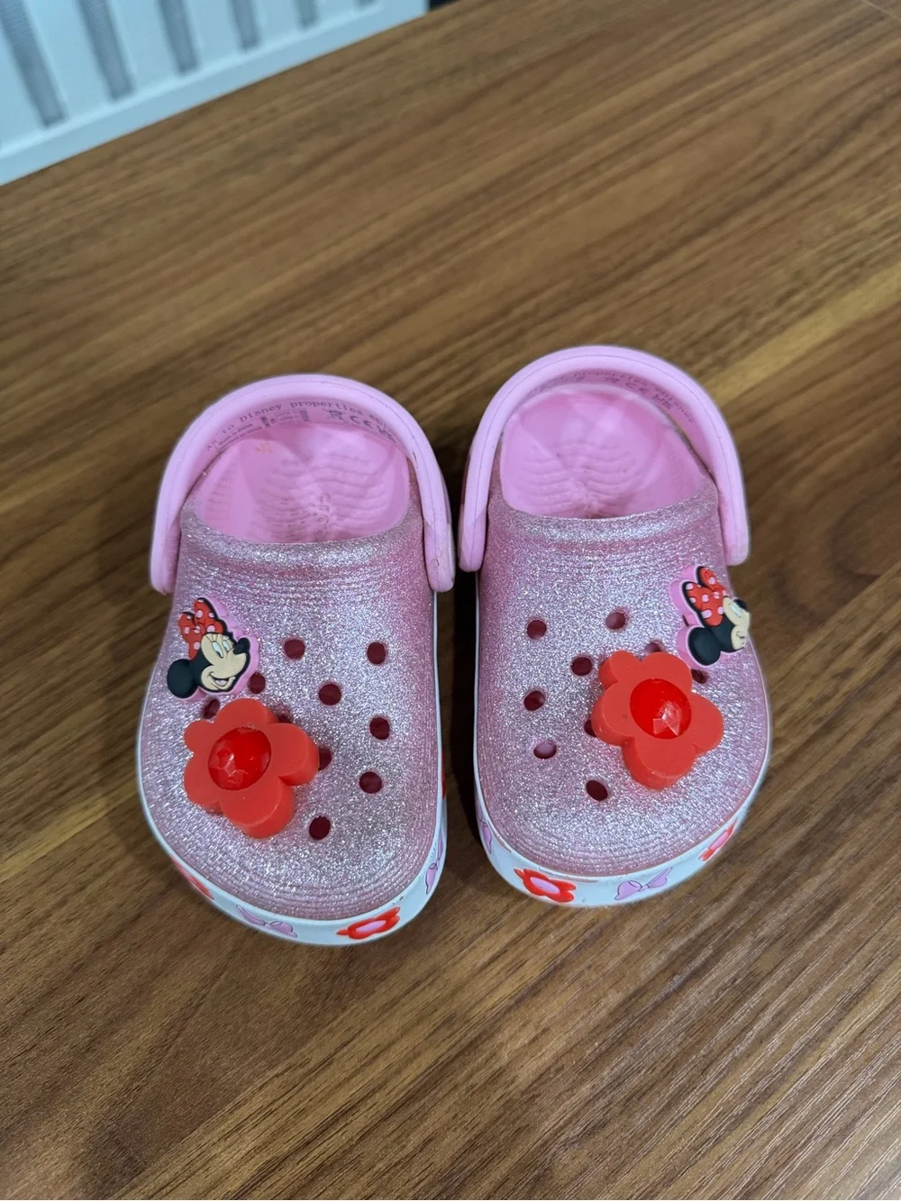 CROCS Kids Pink Glitter Clogs with Red Flower Charms